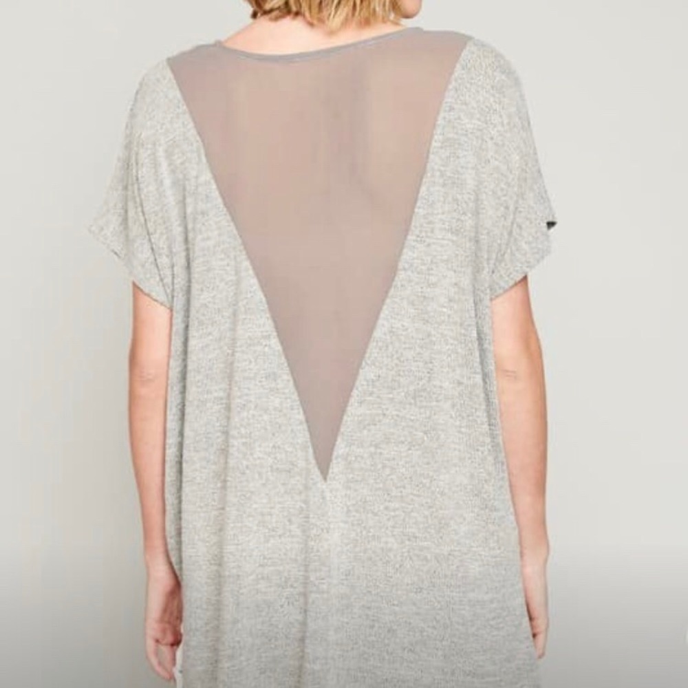 Oversized tee. small but could fit medium or large